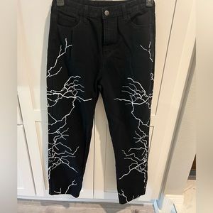 Black jeans with white lightening bolts